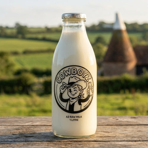 COWBOYZ glass milk bottle with an oast house behind