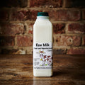 Lincolnshire Poacher raw milk 1 litre on oak table